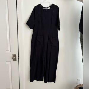 Navy blue romper. Ripply texture, thicker material.